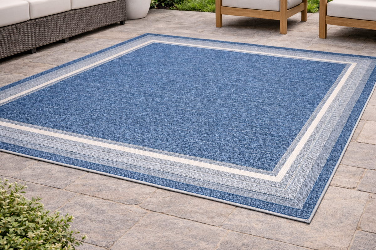 Seaside Harbor Blue Outdoor Rug – Blue patio rug with spa and natural border